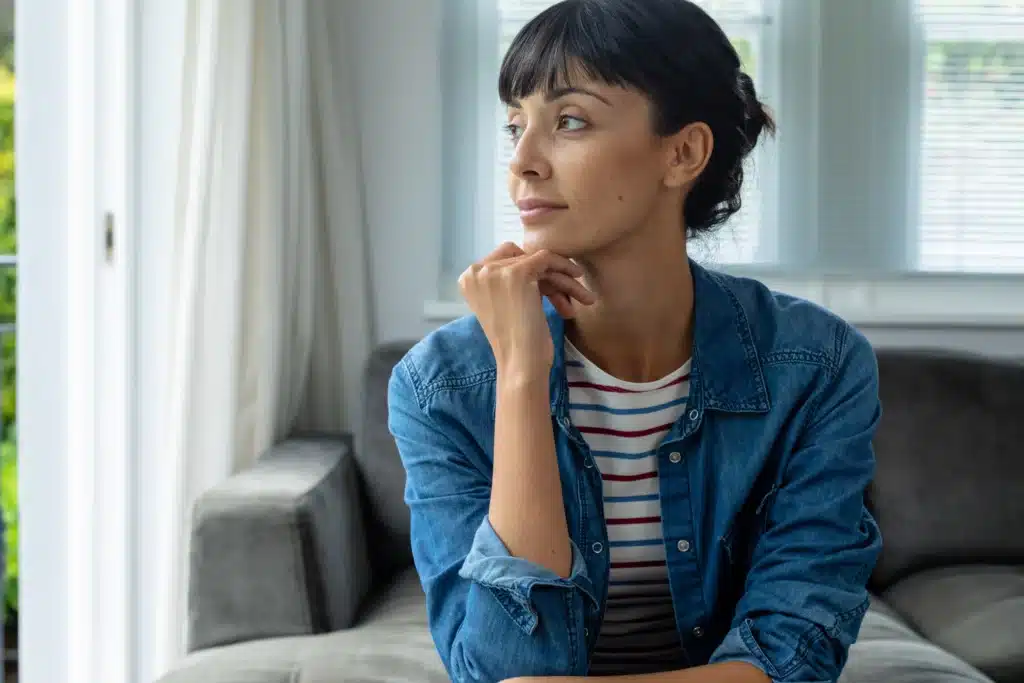 contemplative caucasian young woman sitting with h 2023 11 27 05 01 26 utc