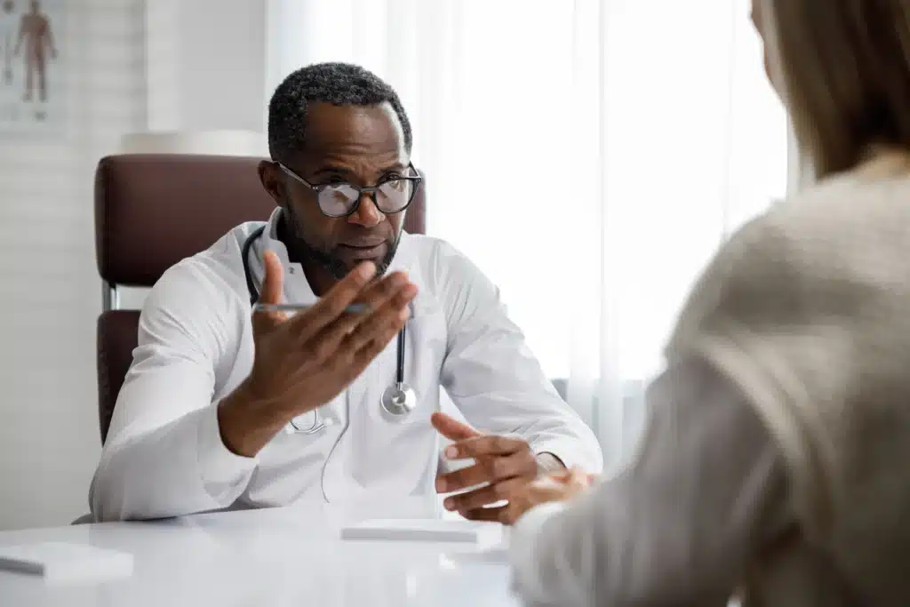 african american doctor receives a patient liste 2023 11 27 05 27 06 utc