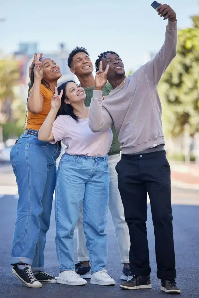 Friends, selfie with peace, urban and group photography in street, smartphone and travel with youth