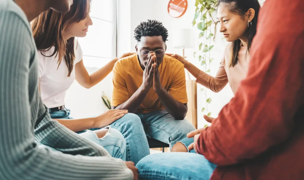 Sad african american guy getting psychological support