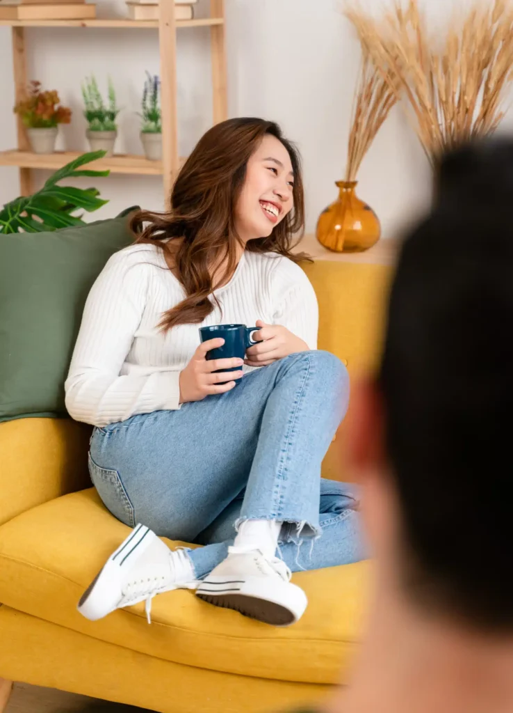 smiling woman with cup of coffee 2023 11 27 04 51 23 utc scaled e1721914627402