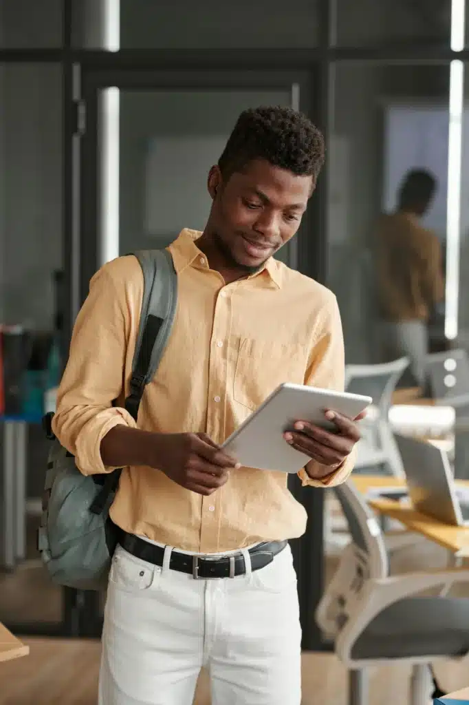 Black guy checking information on tablet