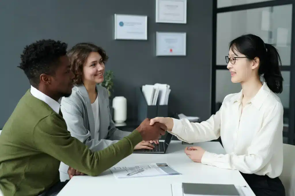 Employer shaking hands with candidate