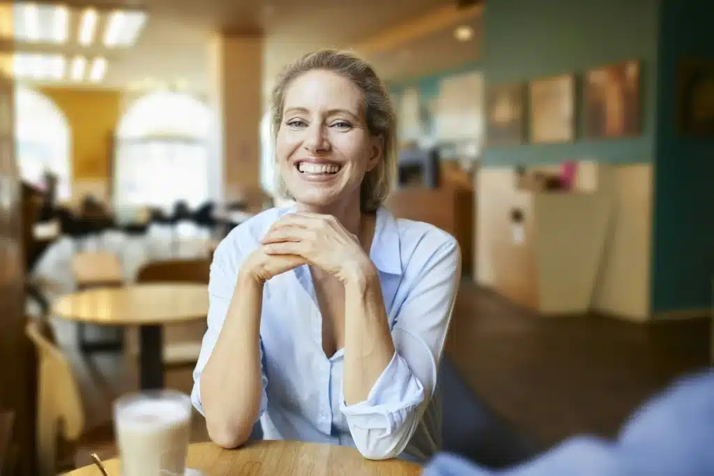 Portrait of happy woman in a cafe