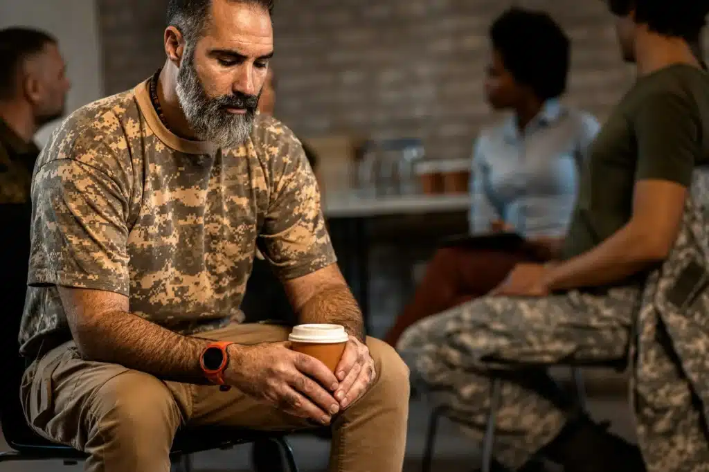 Portrait of male veteran in PTSD support group.