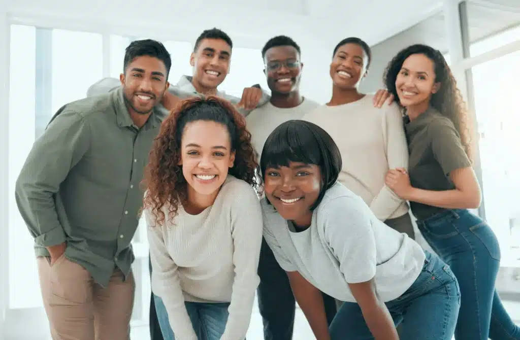 Shot of a diverse group of people standing together after group therapy