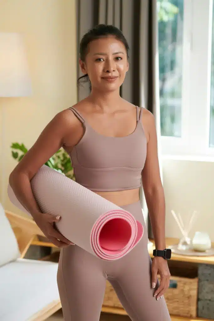 Smiling Woman with Yoga Mat