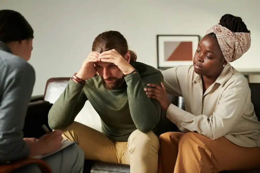 Worried man talking to psychologist