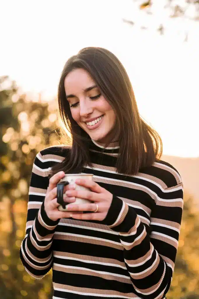 young woman finding happiness and joy outdoors