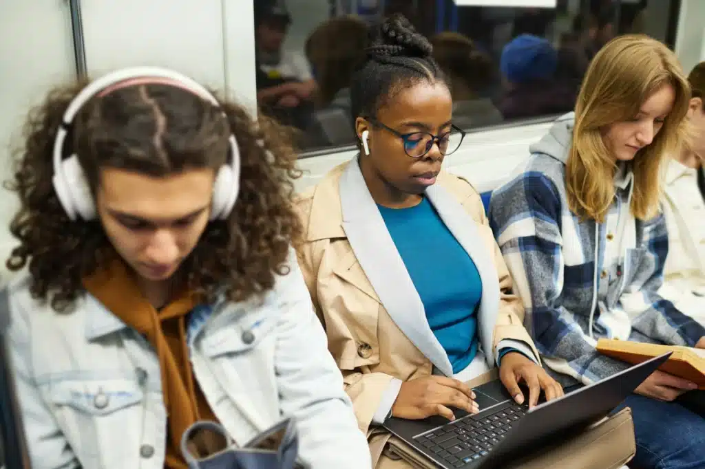 Focus on young African American female passenger with earphones