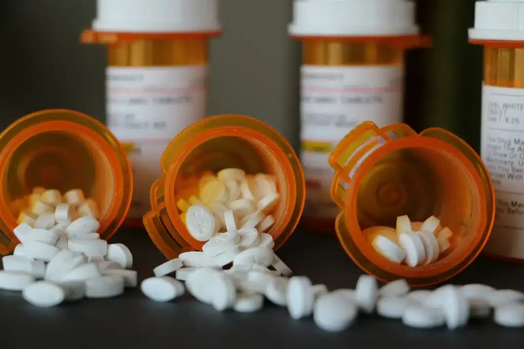 Closeup of pharmaceuticals dumped out on a countertop.