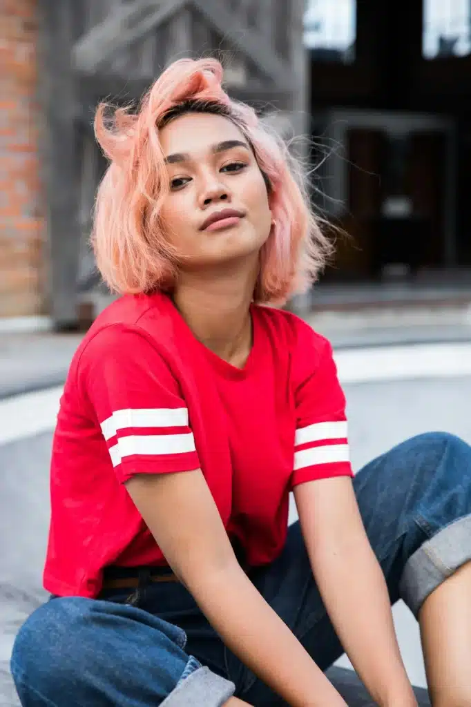 Stylish young Asian woman looking at camera