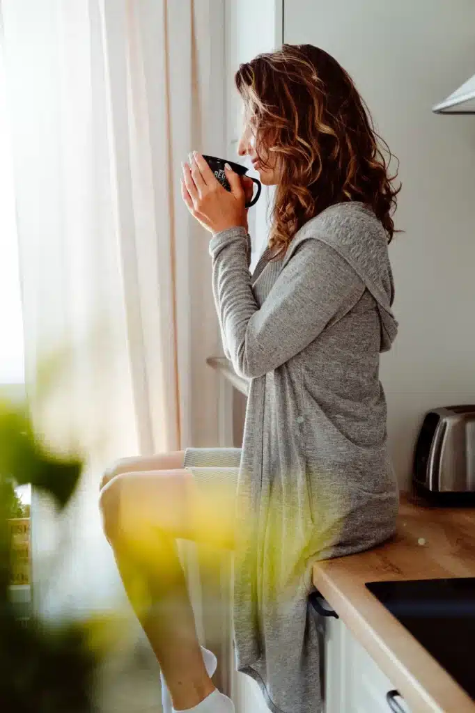 pretty woman drinks coffee